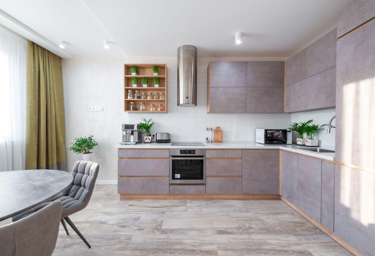 Masonry and Render Painting in Wembley Park — a decorator at work mid-project