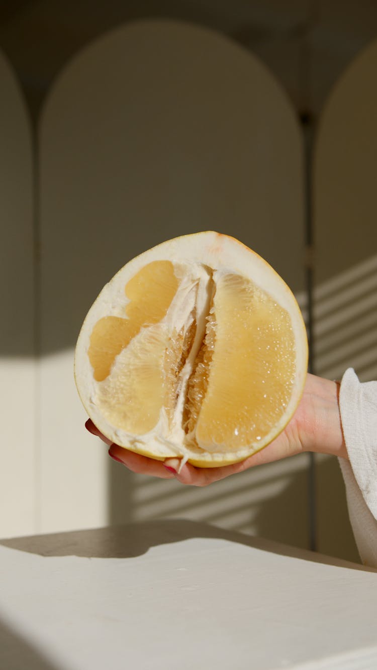 Close Up Photo Of A Sliced Pomelo