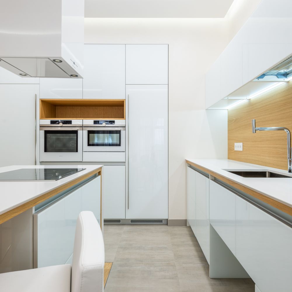 Kitchen Spraying in Cambridge Heath — dust sheets down and the room fully protected