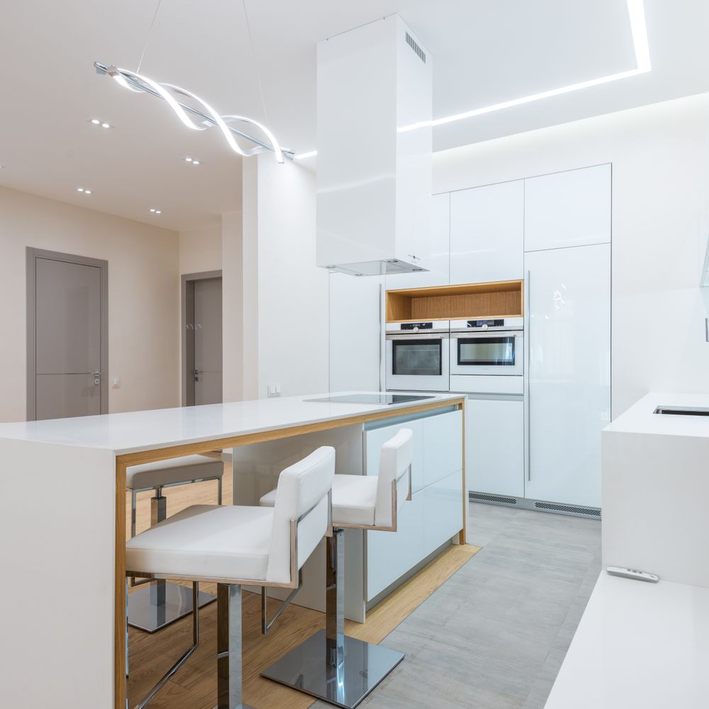 Kitchen Spraying — a decorator at work mid-project