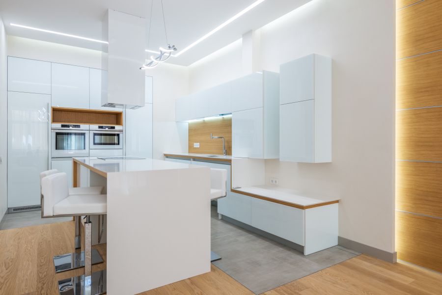 Engineered hardwood kitchen flooring installed in a bright Irvine Spectrum open-concept home