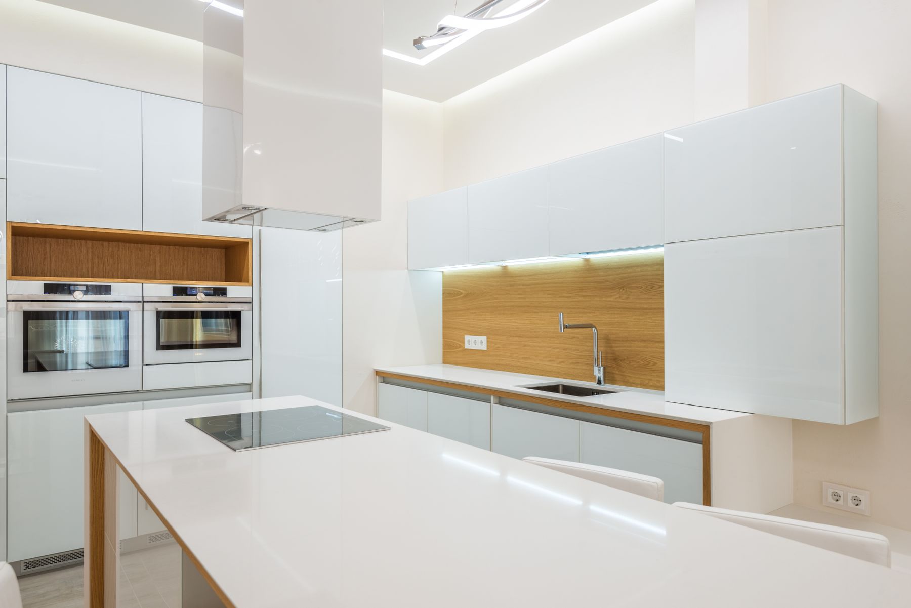 Minimal kitchen with warm timber details