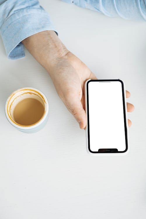 Free Person Holding White Mobile Phone Stock Photo