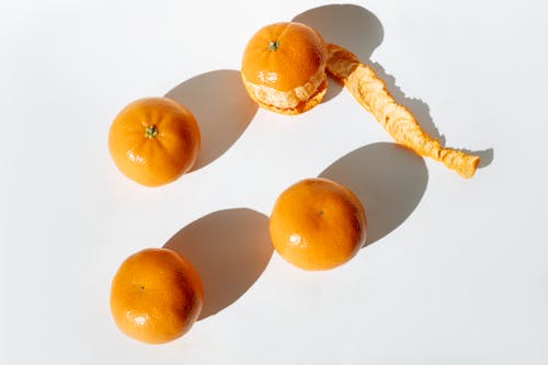 Orange Fruits on White Surface