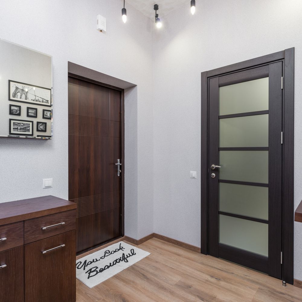 Wallpapering in Stonebridge — woodwork brushed to a crisp, smooth line