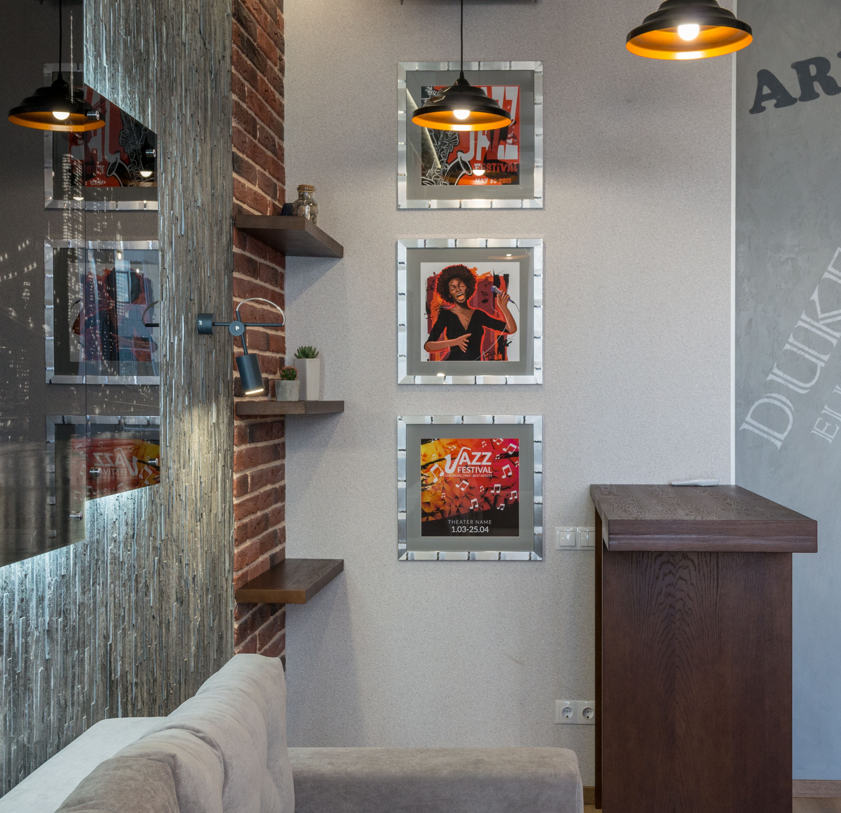 Multiple framed artworks hung safely on apartment wall without visible damage