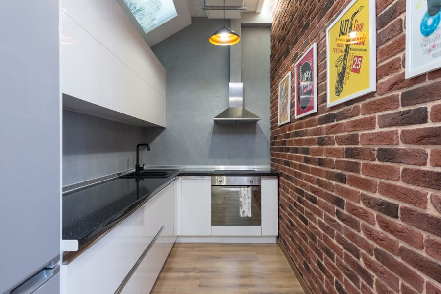 Compact remodeled kitchen with vertical storage in an Irvine attached townhome