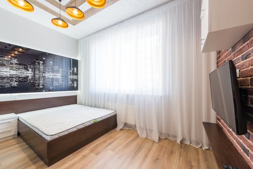 Free Stylish bedroom with modern TV Stock Photo