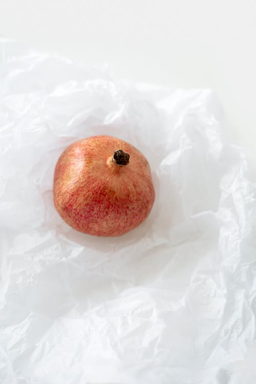 Red Apple on White Textile