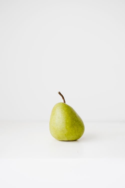 Free Fresh healthy pear on white surface Stock Photo