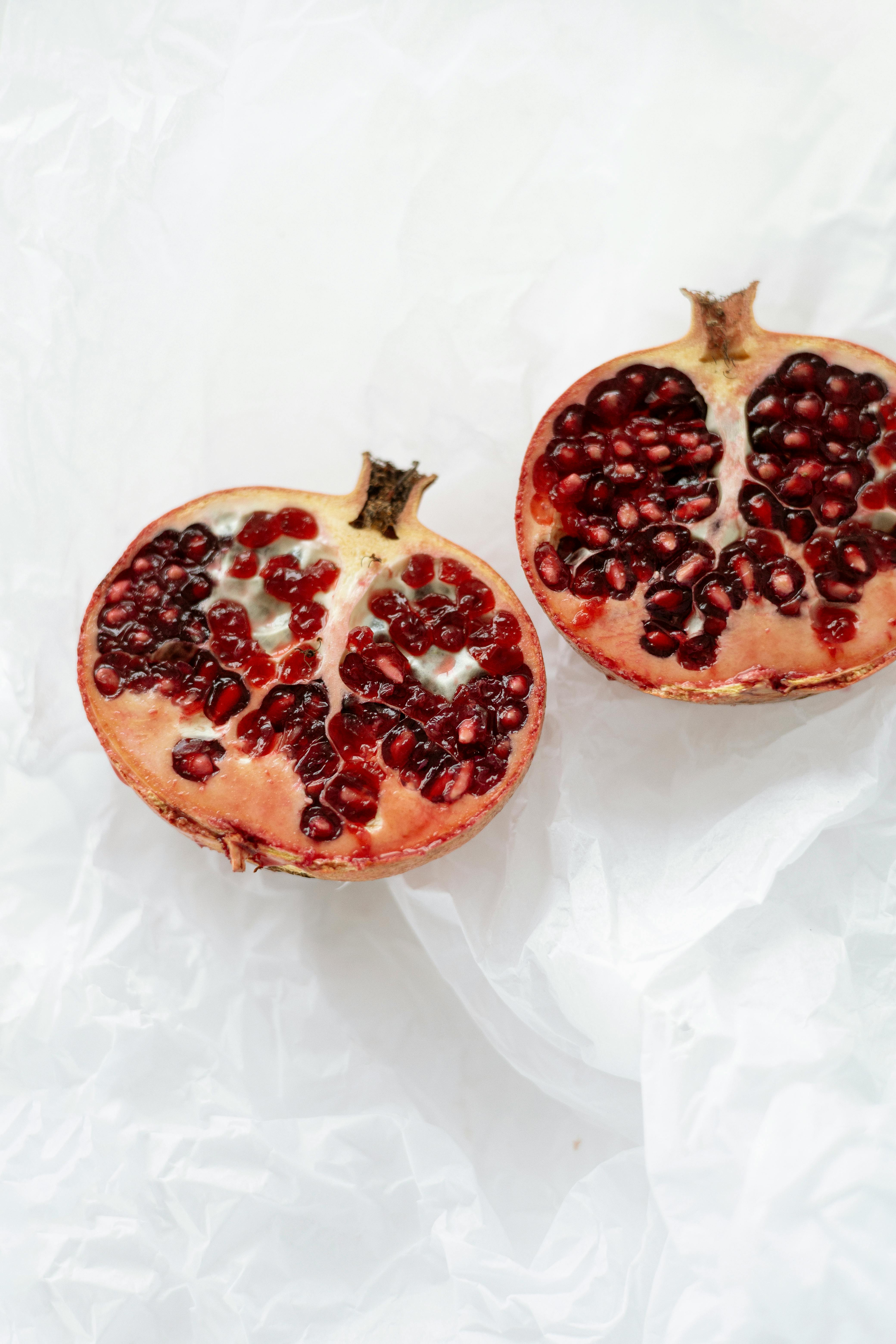 red fruit on white textile