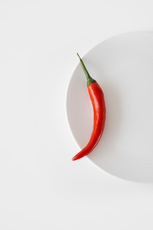 Red Chili on White Round Plate