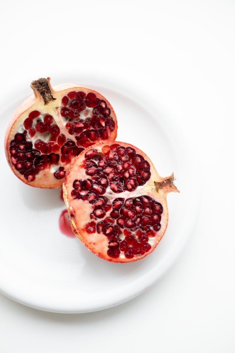 Sliced Pomegranate On A Plate 