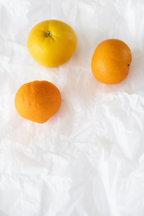 Orange Fruit on White Surface