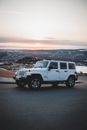 SUV car riding along river
