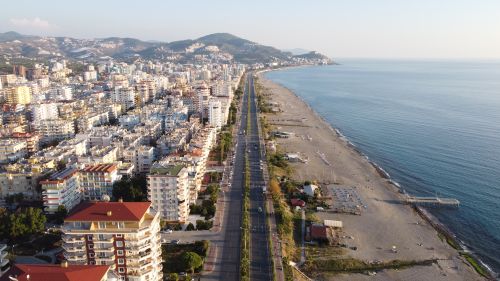 Free Aerial view showcasing Alanya's coastline, high rises, and beaches in Turkey. Stock Photo