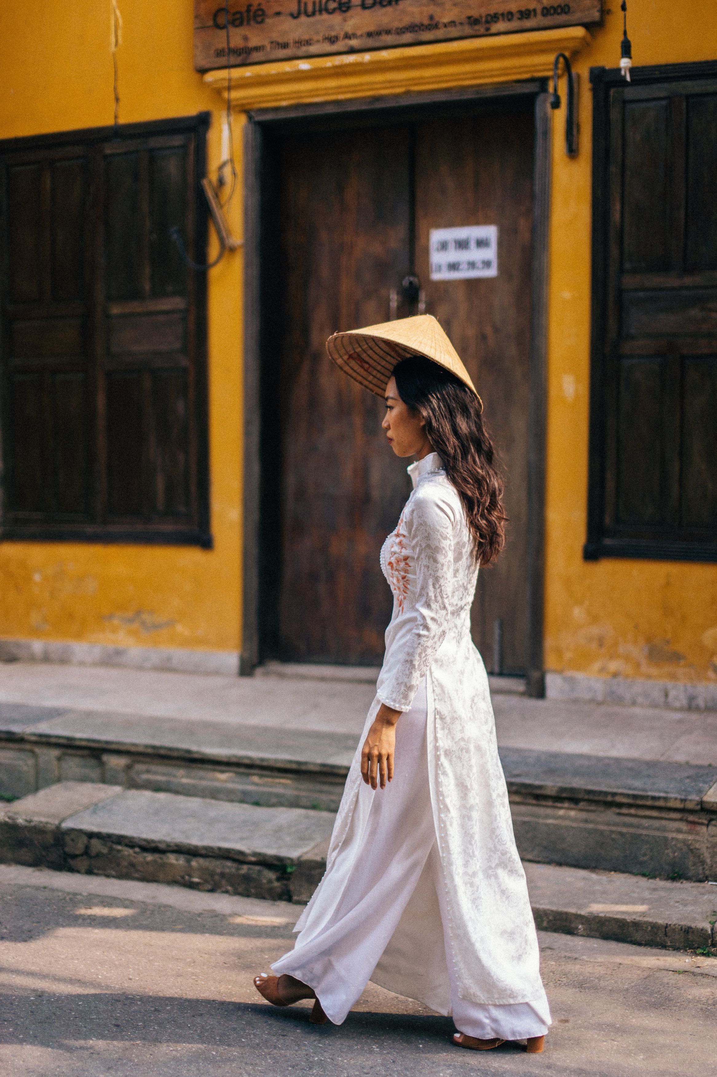 A Woman in White Dress Walking on the Street · Free Stock Photo