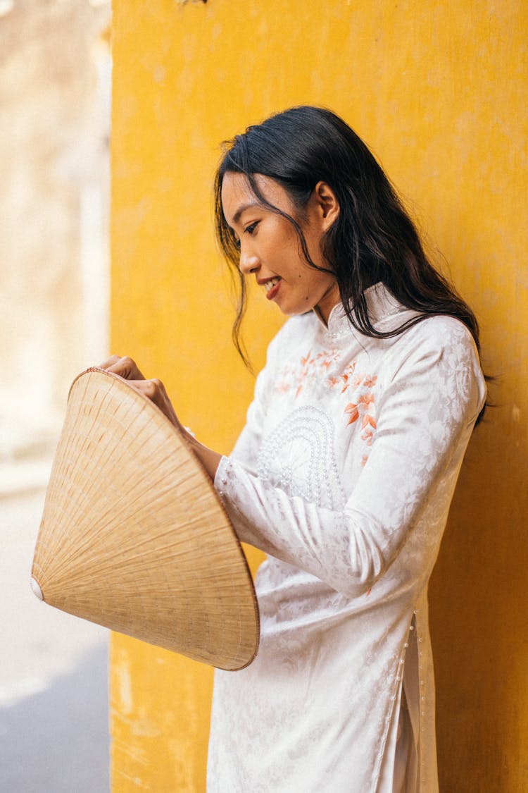 Woman Holding A Rice Hat