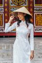 Woman in White Long Sleeve Dress Wearing Brown Straw Hat