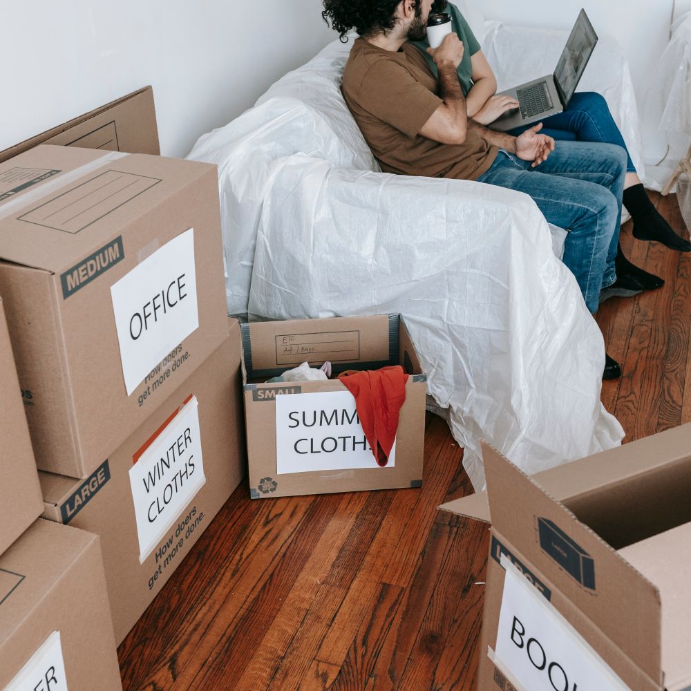 Cunningham — movers carrying boxes for a flat move