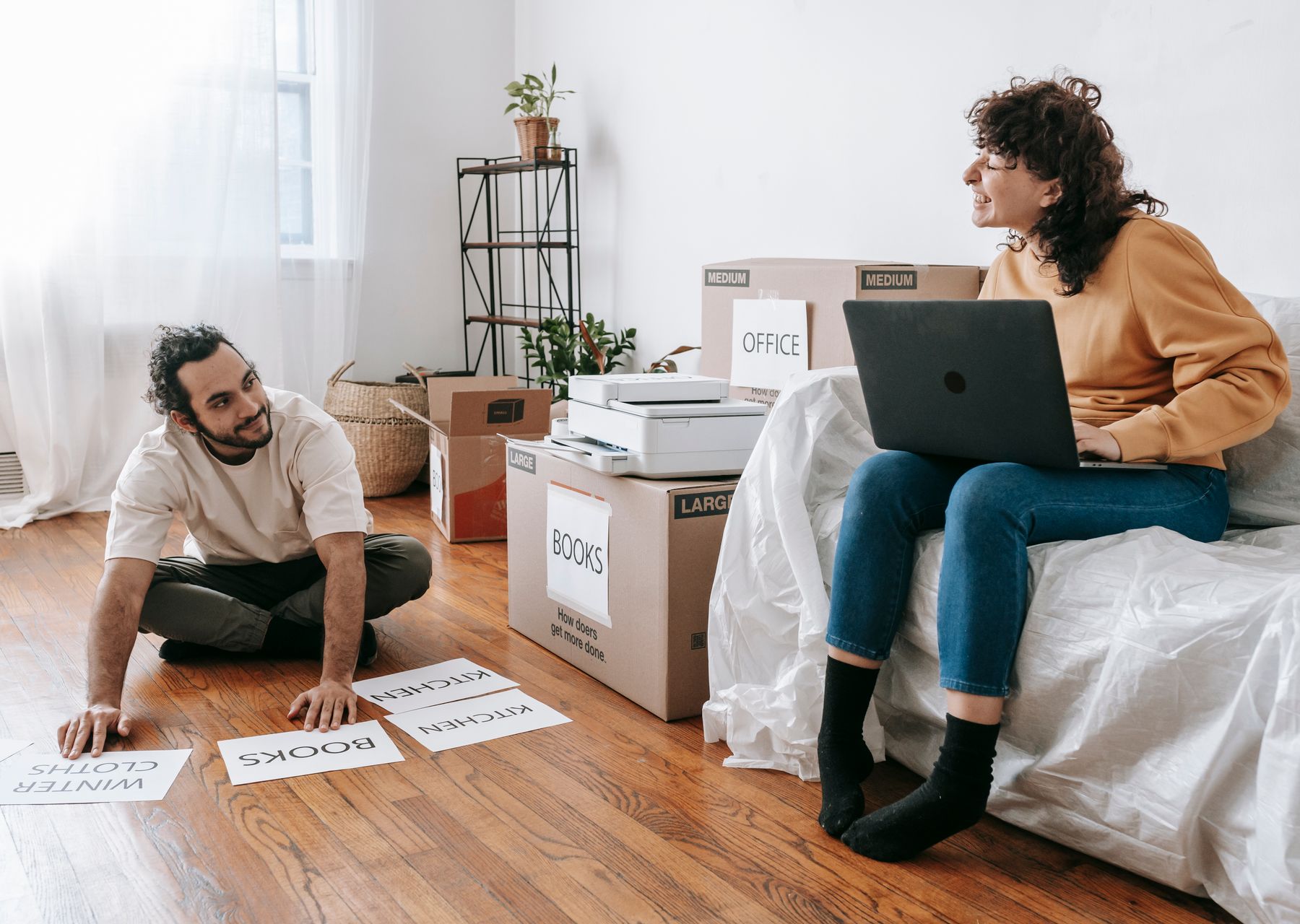 Packing services in Beith — crew wrapping and loading on moving day