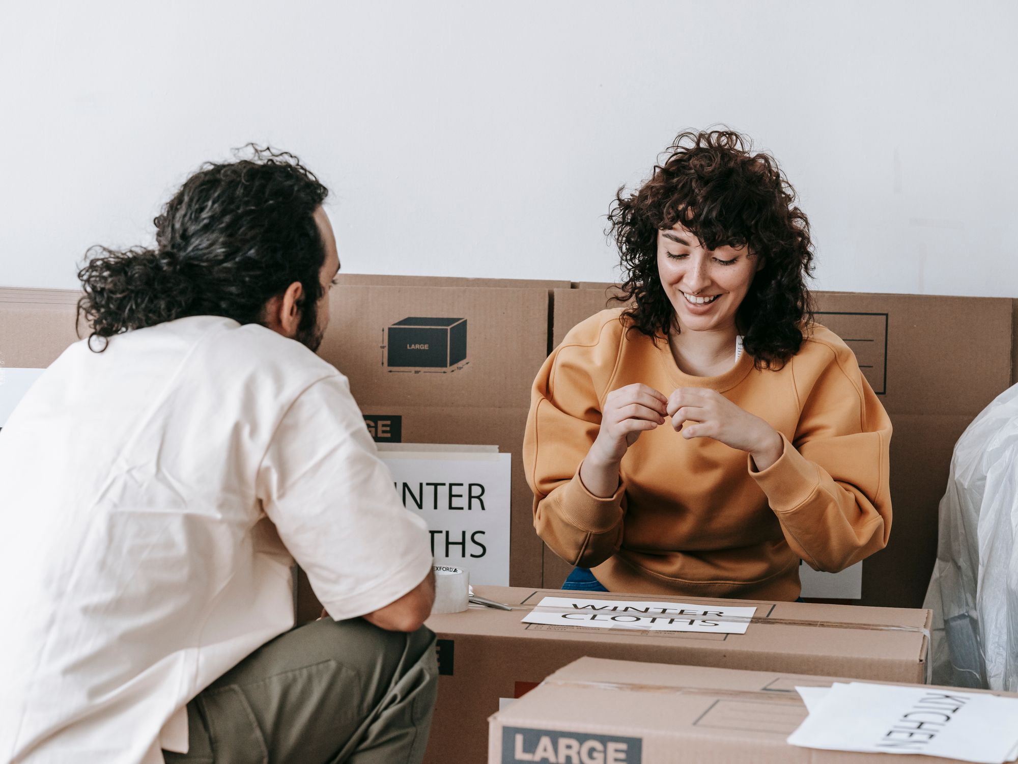 Flat Removals in Bakewell, East Midlands — movers carrying boxes for a flat move