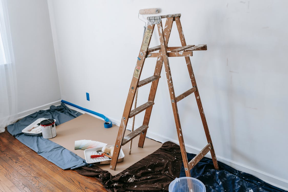Free A Dirty Wooden Stepladder In A Room Stock Photo
