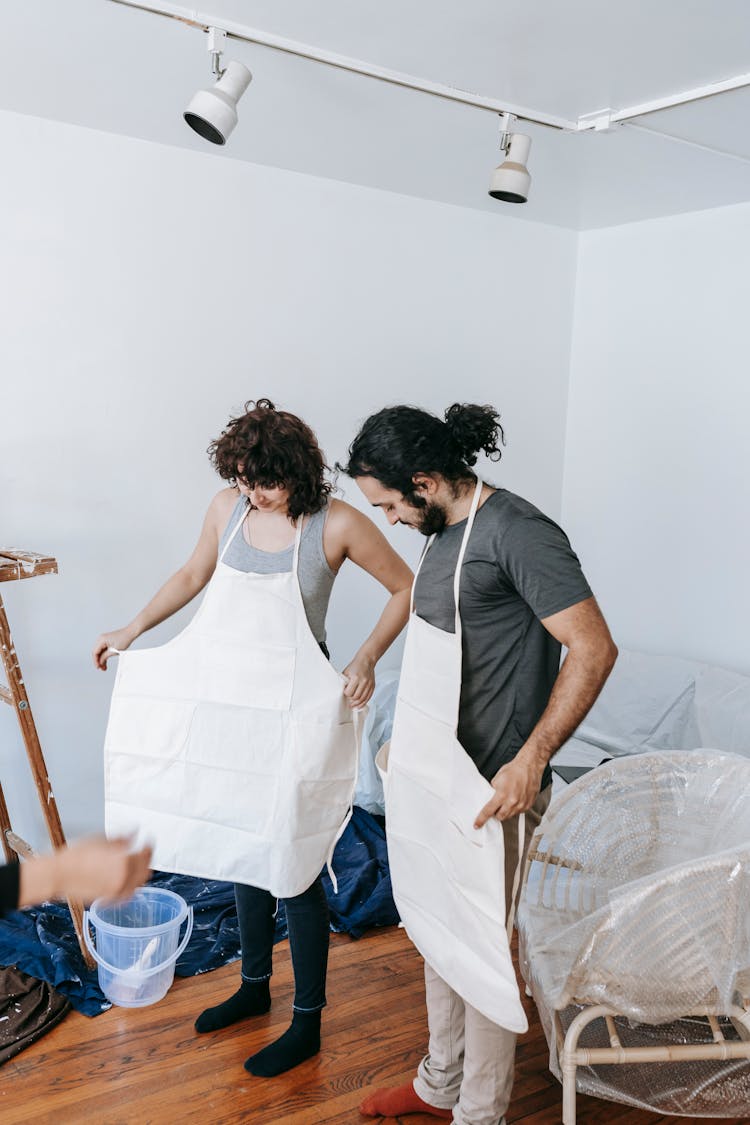 Couple Putting On Their Work Clothes