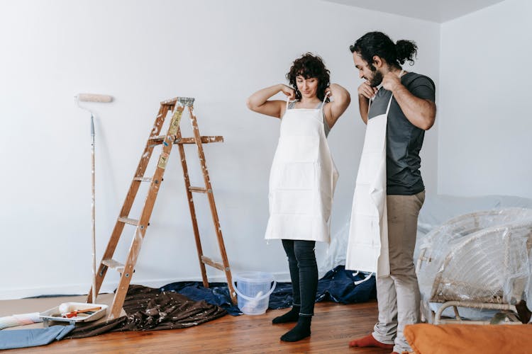 Couple Putting On Their Work Clothes