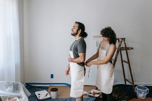 satisfied couple in completed home renovation
