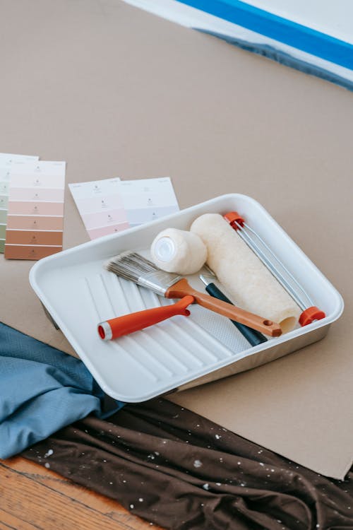 Paint Roller And Brush On Plastic Tray