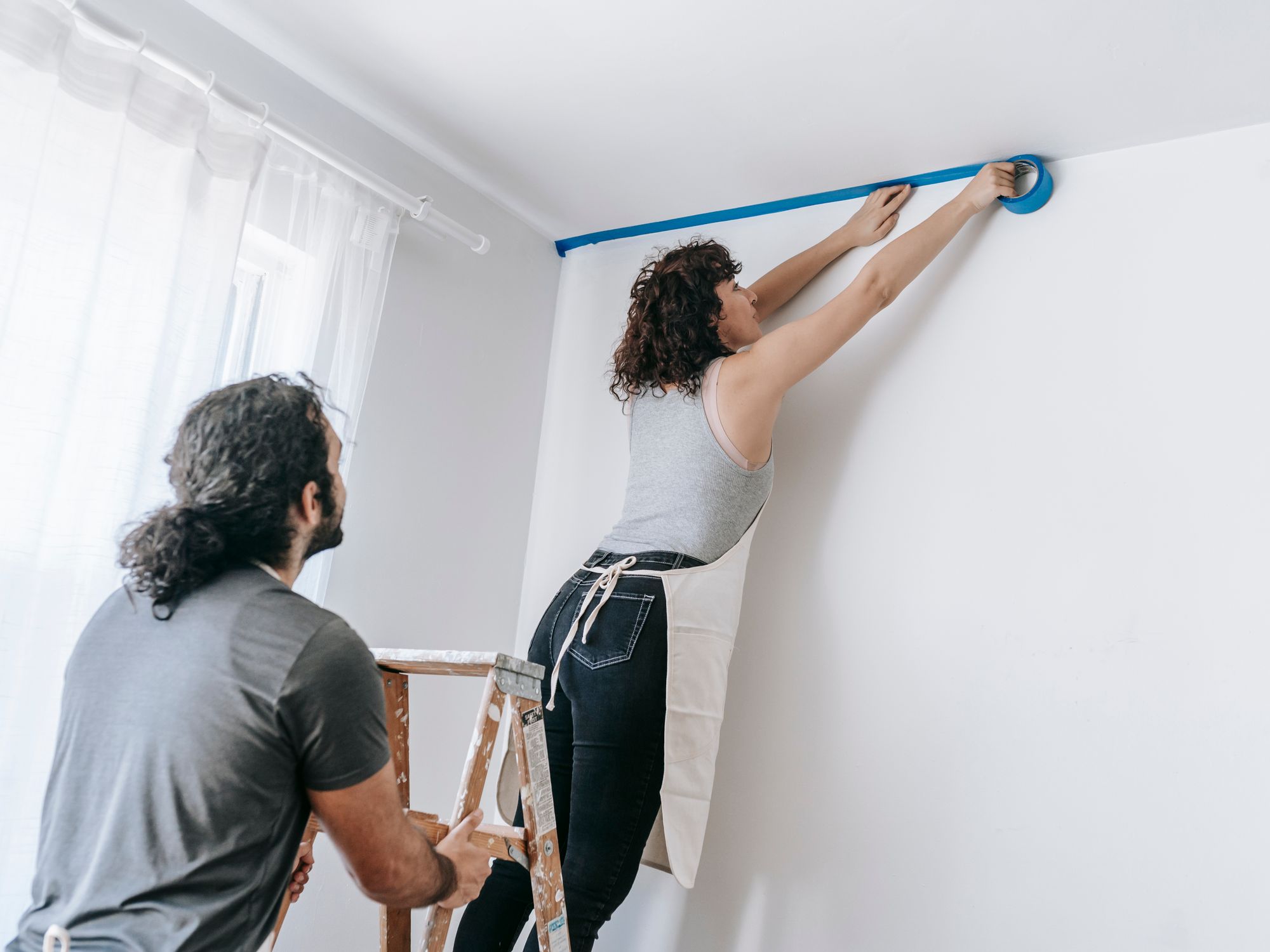 Masonry and Render Painting in Stanmore, Harrow — professional painter and decorator at work