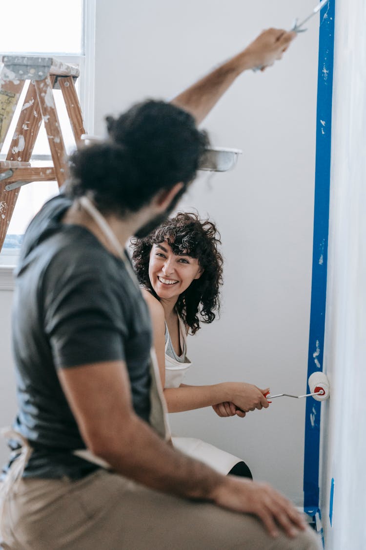 A Couple Enjoying While Painting