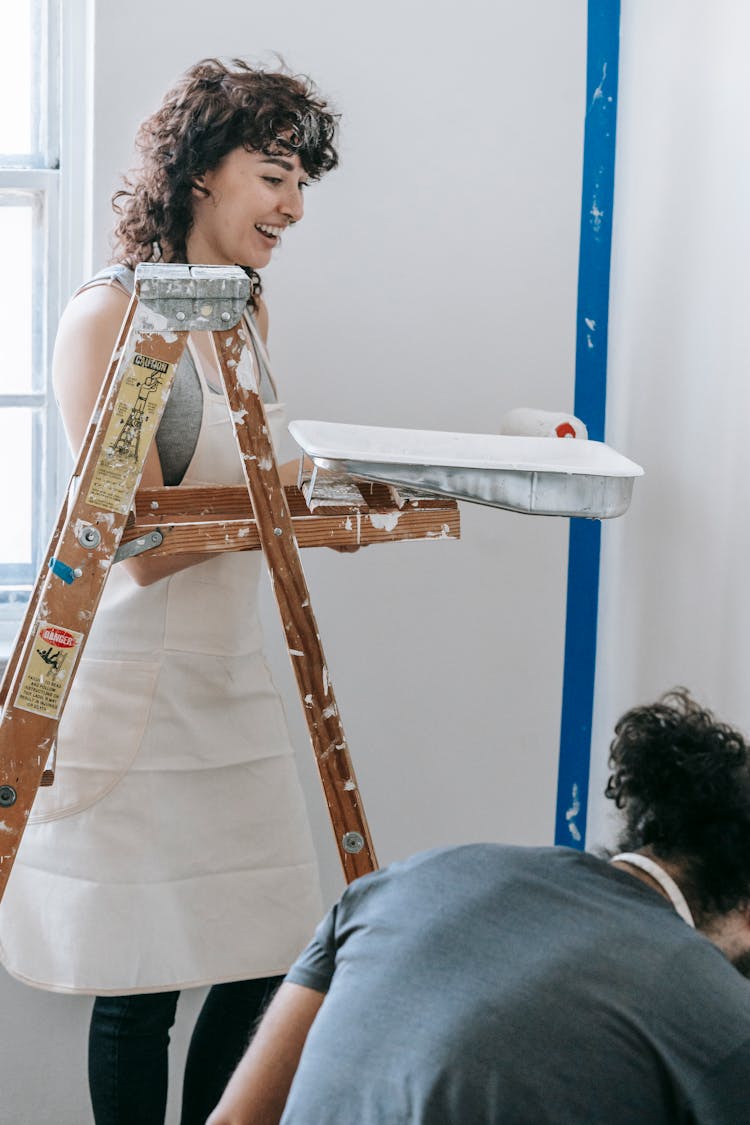 Couple Painting The Wall