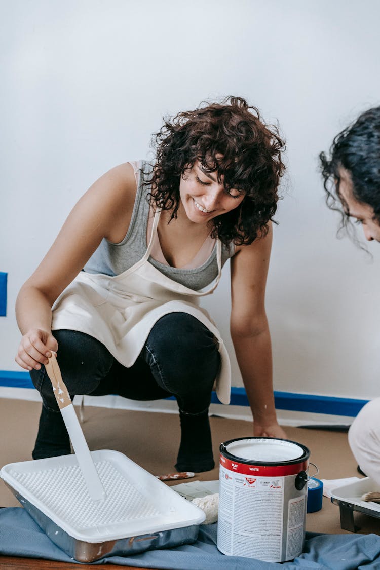 Woman Mixing The Paint