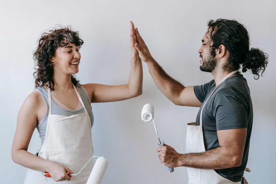 Happy couple after home renovation