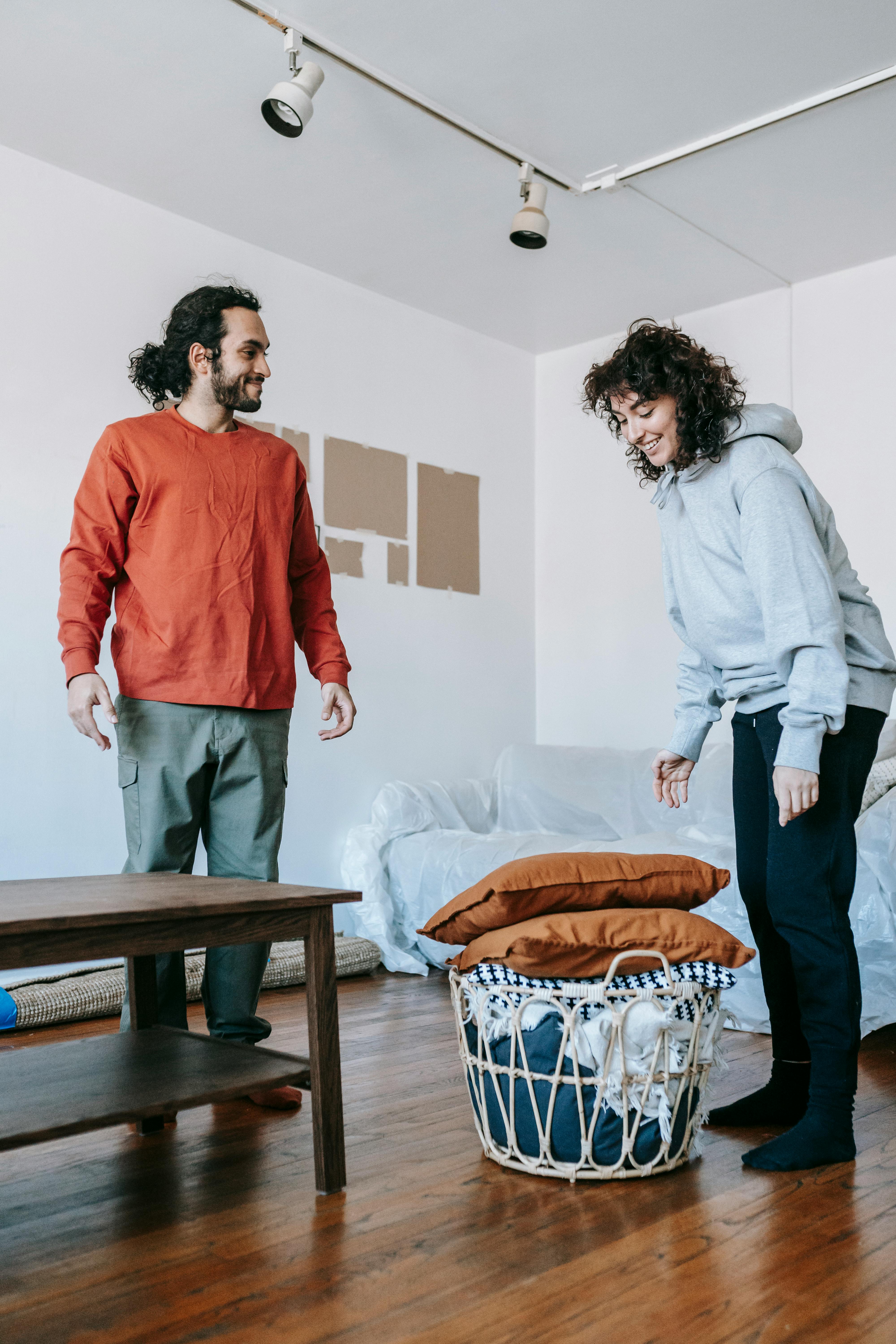 couple packing up furnitures and things inside the house