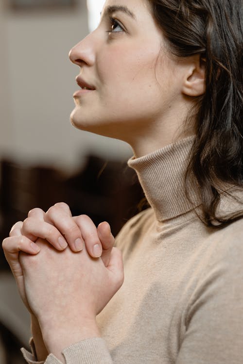 Close-Up View of a Woman Praying