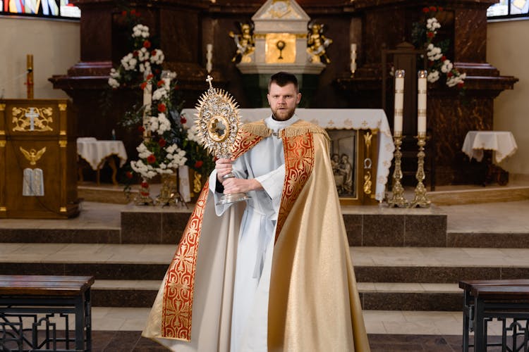 A Priest In Beige Vestment