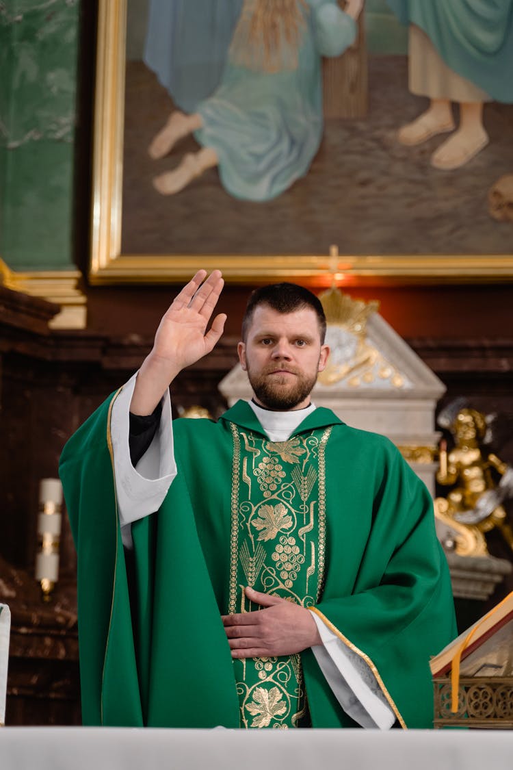 A Priest In Green Vestment