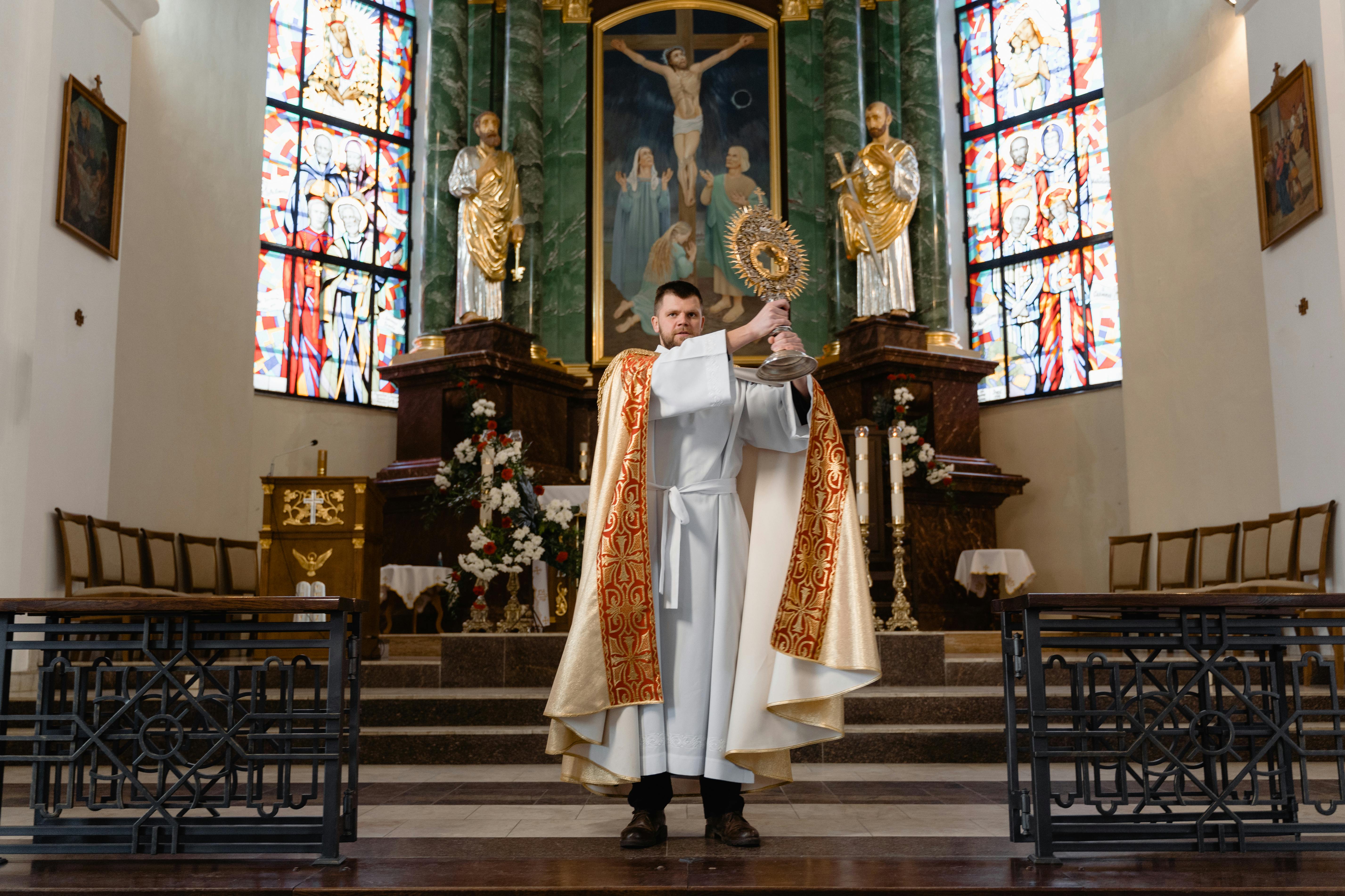 a priest in beige vestment