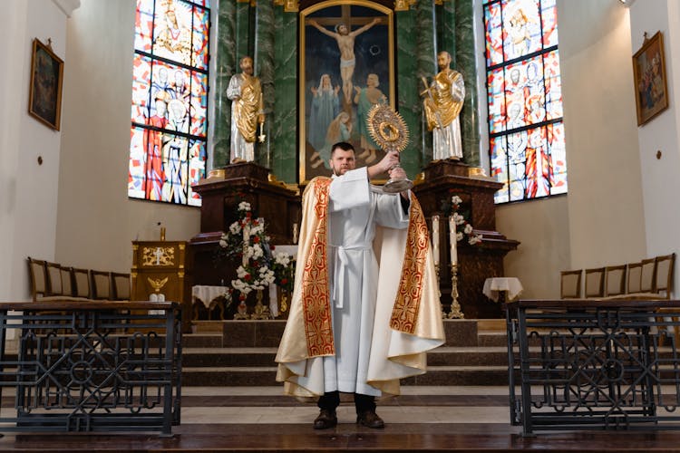 A Priest In Beige Vestment