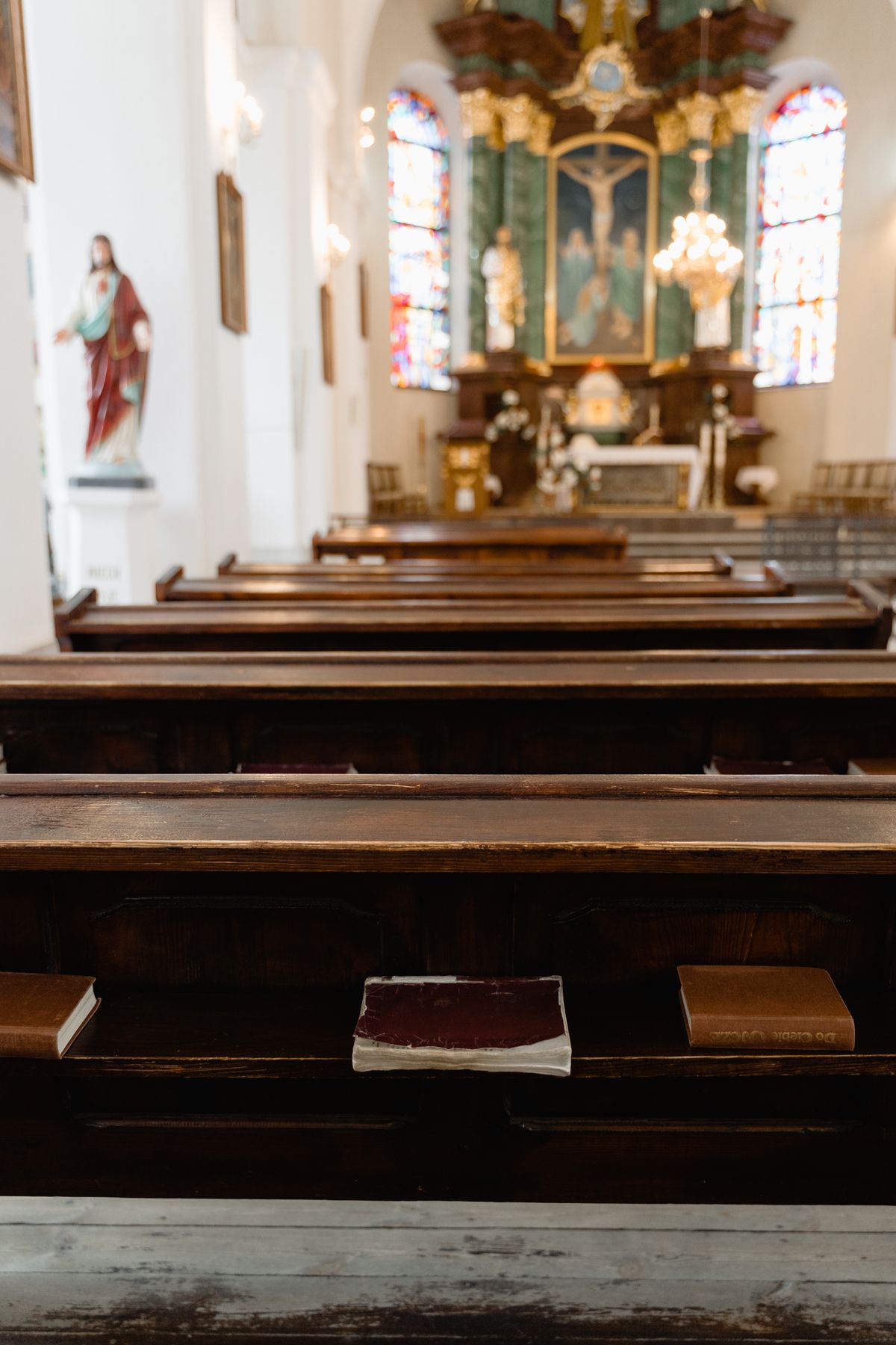 Richly decorated church altar beneath a vibrant fresco