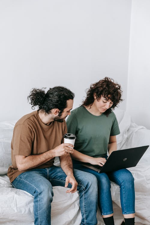 Free Couple Using A Computer Laptop Stock Photo