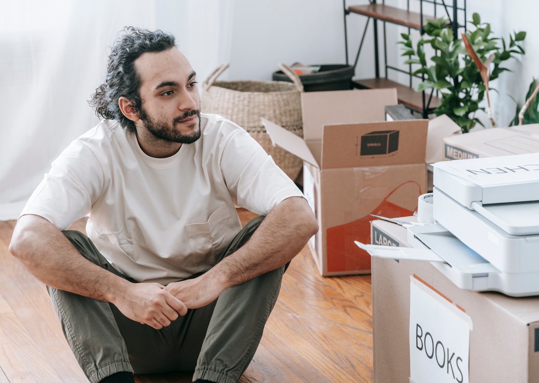 House removals in Greenwich — crew wrapping and loading on moving day