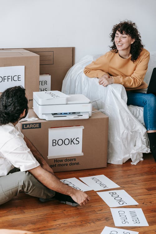 Man Printing Signs For Boxes