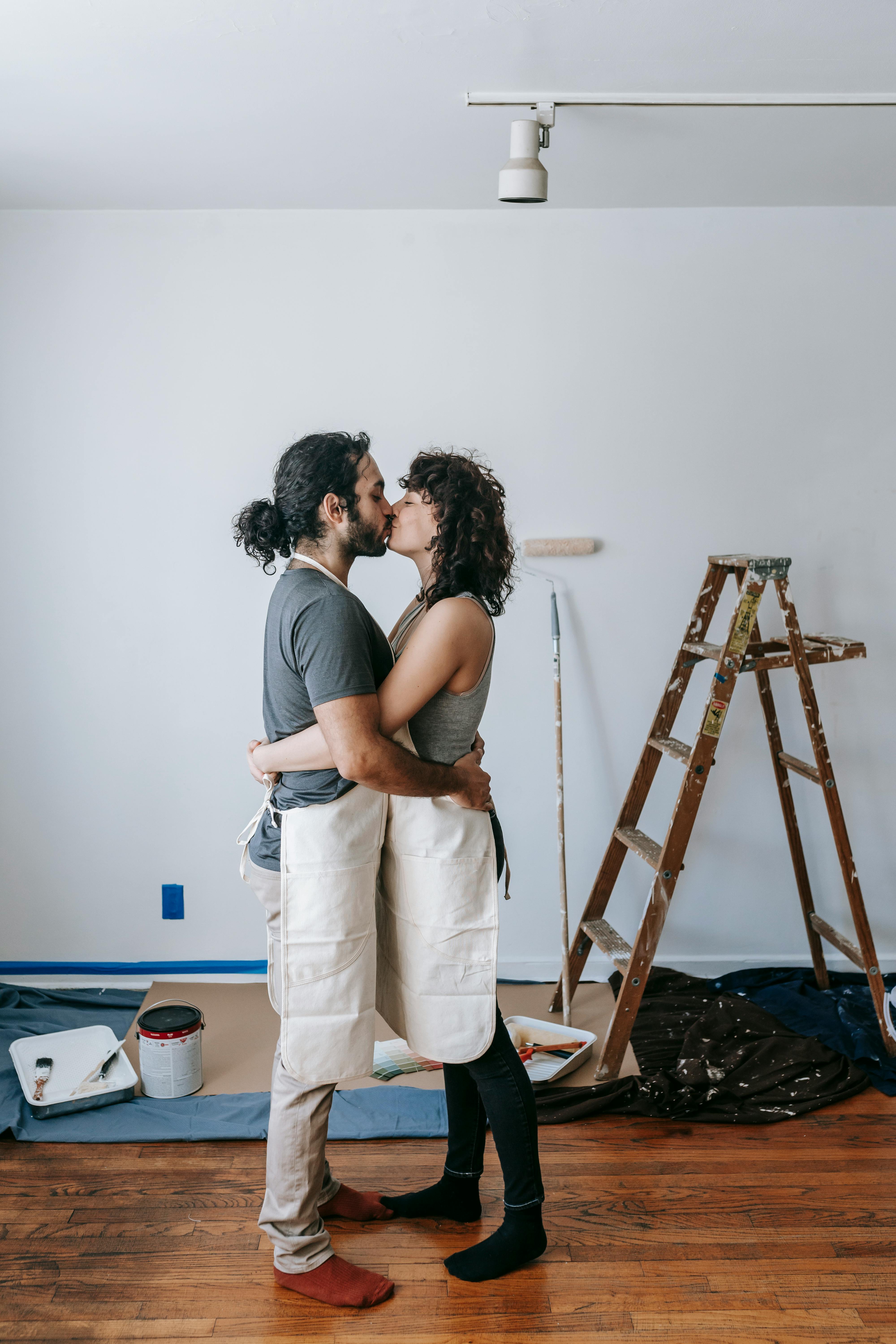 Couple Kissing While Having A Break At Work
