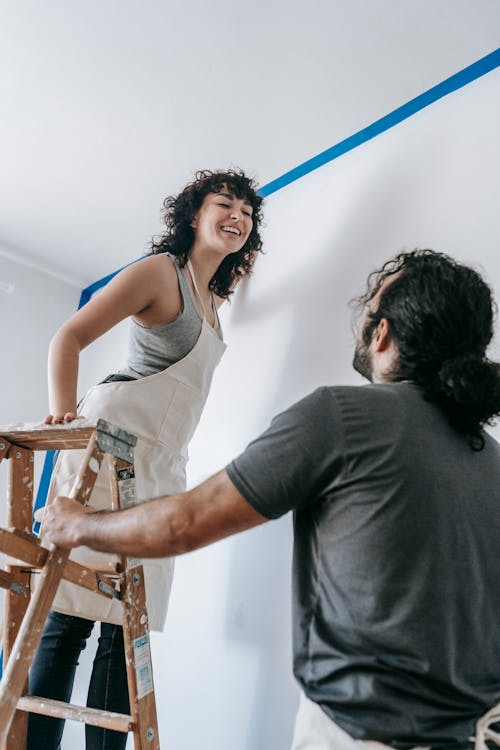 A Happy Couple Enjoying While Working