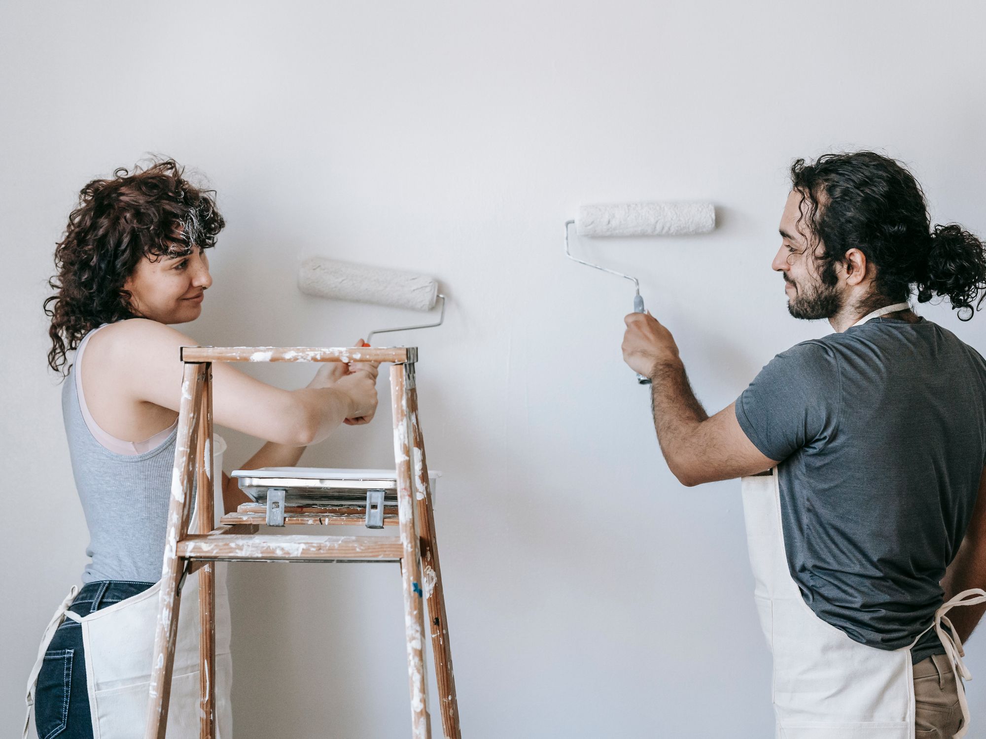 Exterior Painting in Acton, Ealing — painter refreshing a house exterior in weatherproof paint