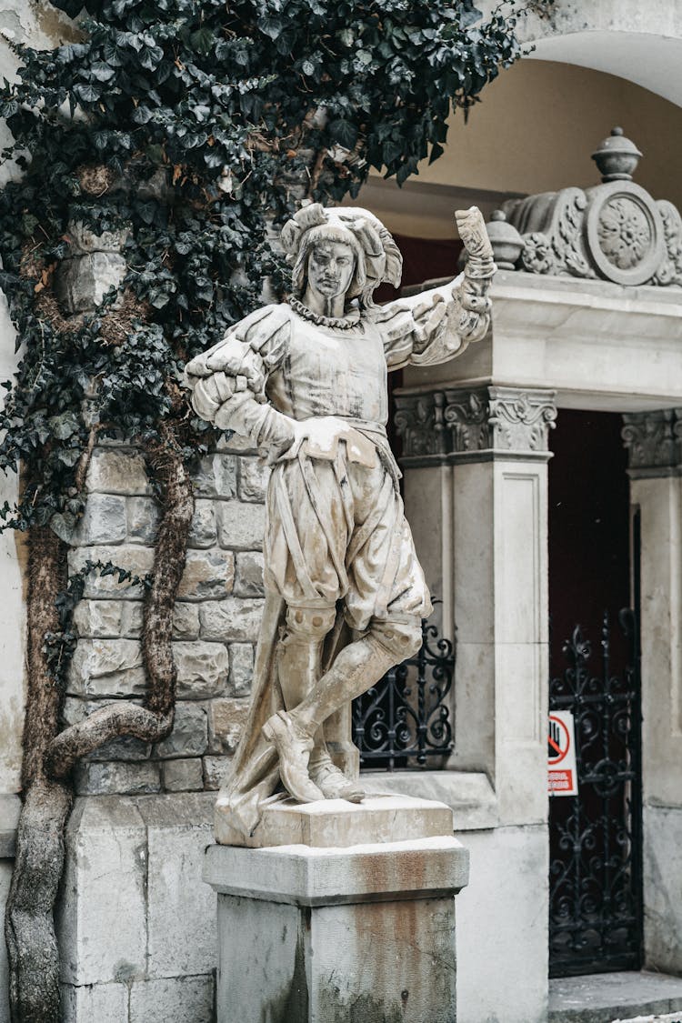 Stone Sculpture With Ornament On Pedestal In Town